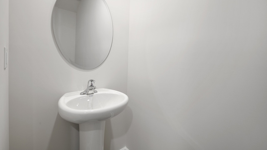 Bathroom with white cabinets