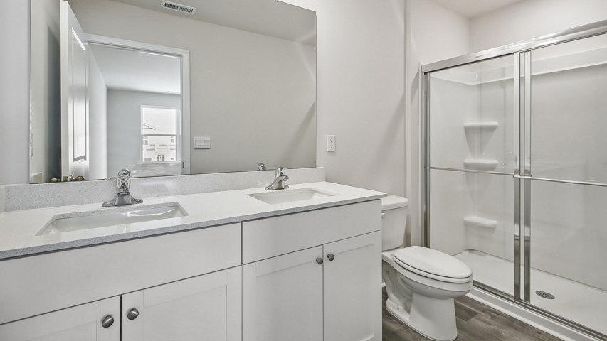 Bathroom with white cabinets