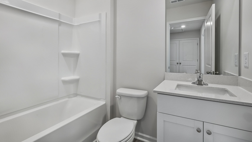 Bathroom with white cabinets