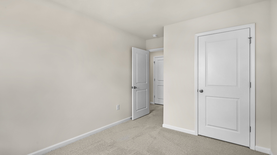 additional bedroom with window, carpeting, closet