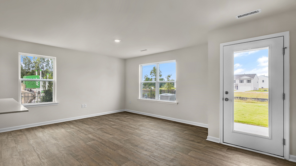 open concept dining space with door to patio