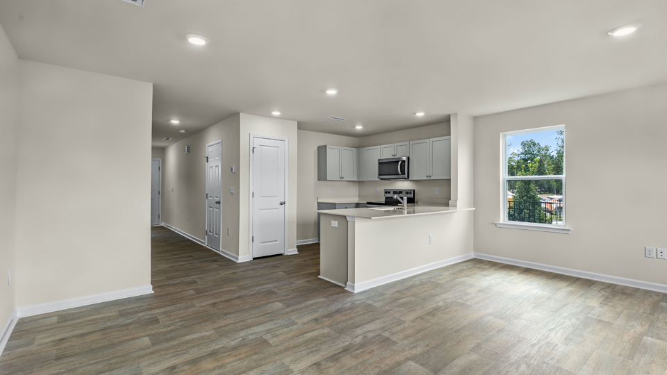 open concept living space with large windows