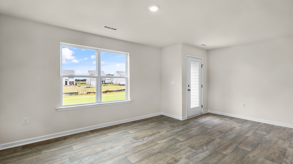 open concept living space with large windows