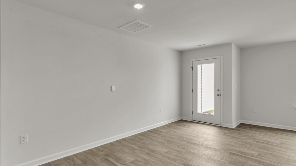 open concept dining space with door to patio