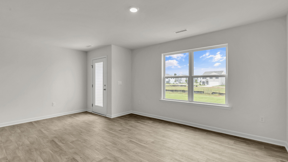 open concept living space with large windows