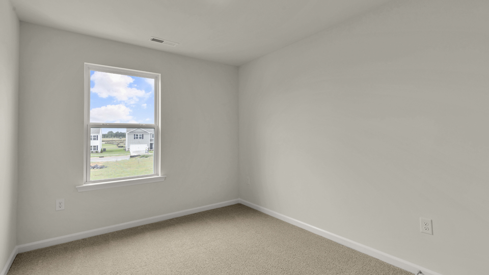 additional bedroom with window, carpeting, closet