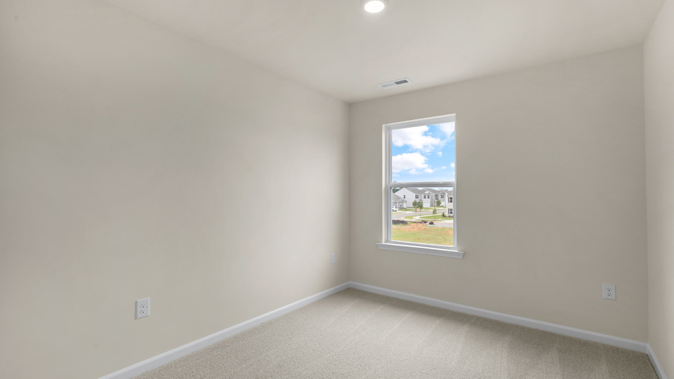 additional bedroom with window, carpeting, closet