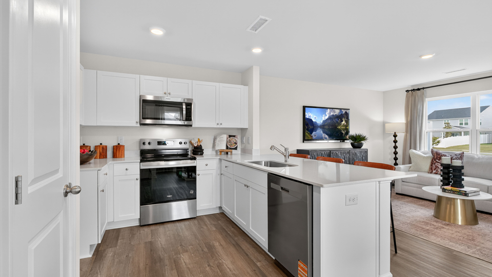 kitchen with white cabinets and quartz countertops