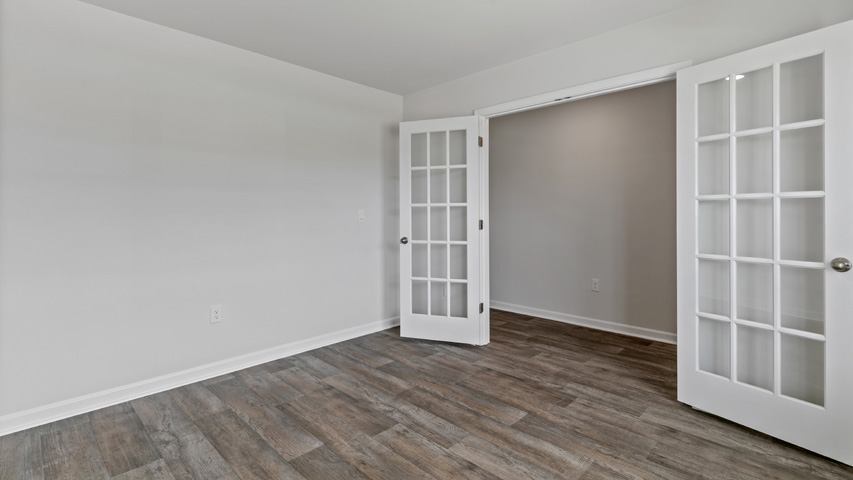 flex room with french doors and lvp flooring
