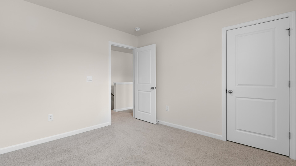 third bedroom with carpeting