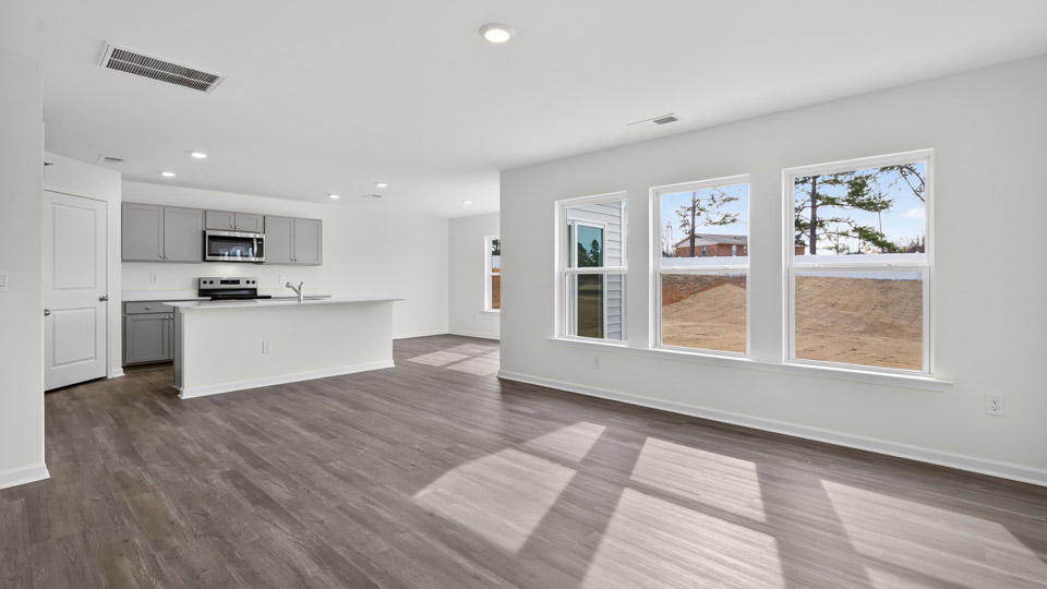 open concept living space with large windows