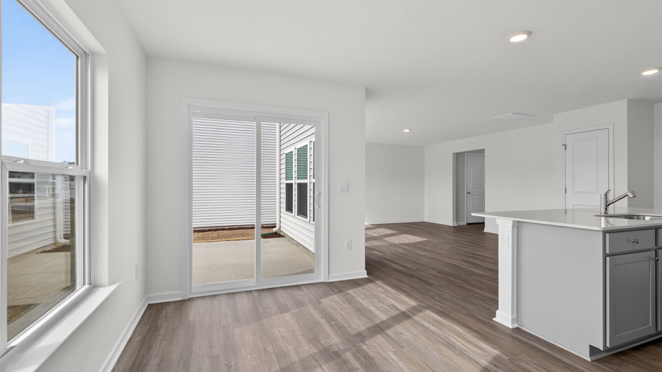 open concept dining space with sliding glass door to patio