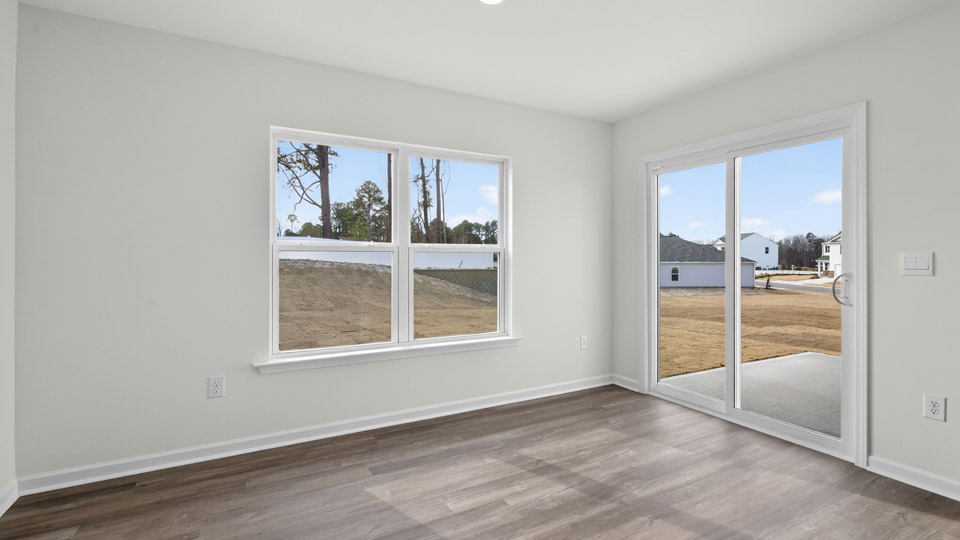open concept dining space with sliding glass door to patio