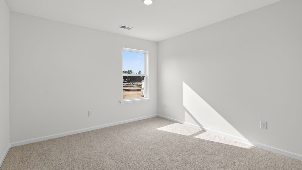 additional bedroom with window, carpeting, closet
