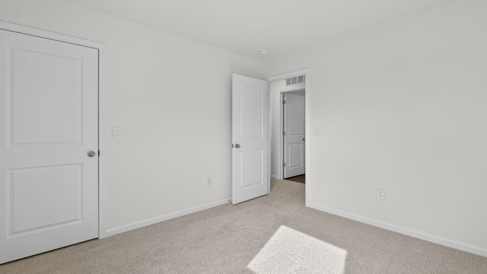 additional bedroom with window, carpeting, closet