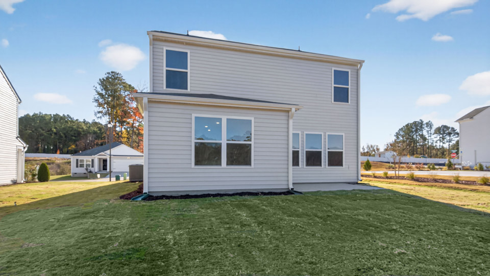 back exterior Darwin A2, patio with concrete slab and open yard