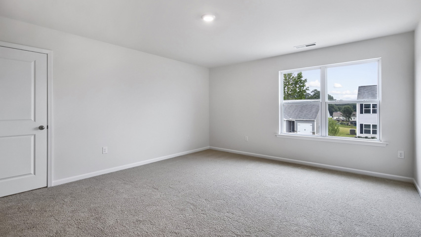 Bedroom with carpet flooring