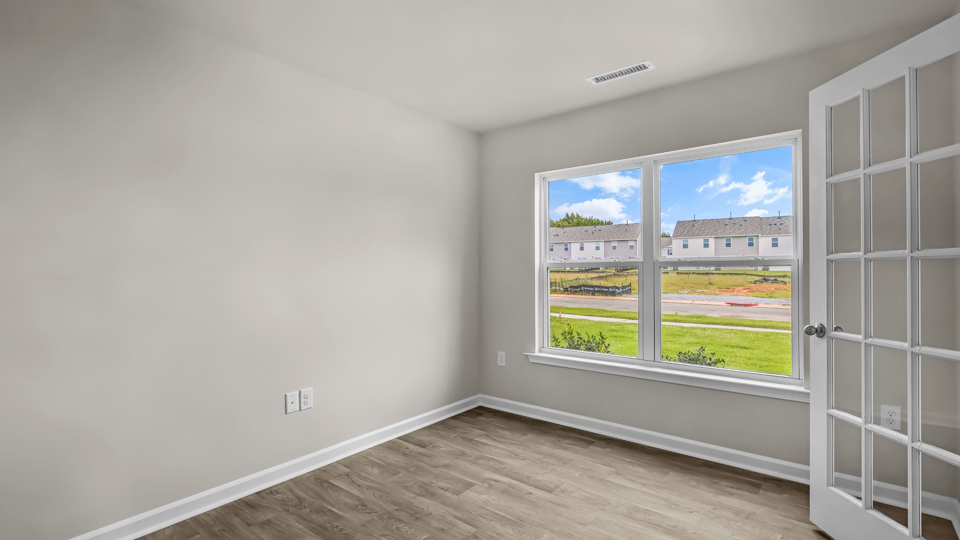 flex room with large windows, french doors