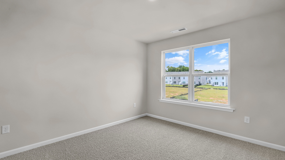 additional bedroom with window, carpeting, closet