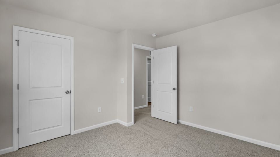 additional bedroom with window, carpeting, closet