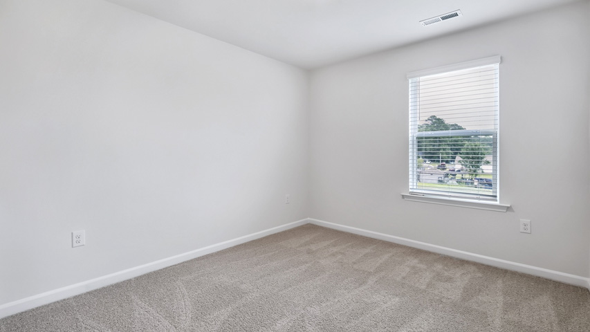 Bedroom with carpet