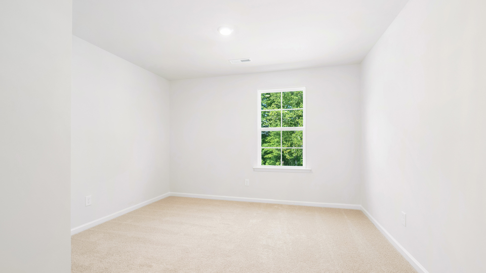 Bedroom with carpet flooring