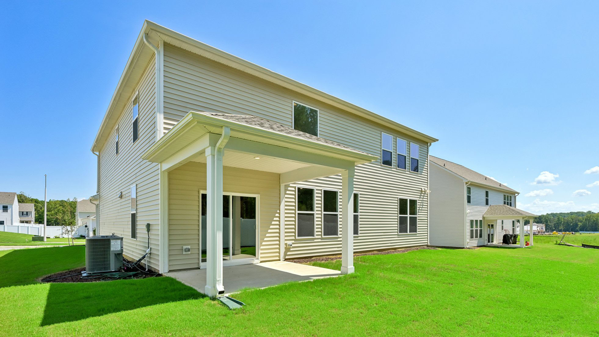back of home with covered back patio