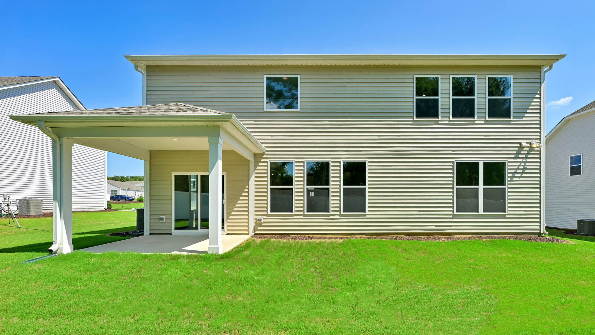 back of home with covered back patio