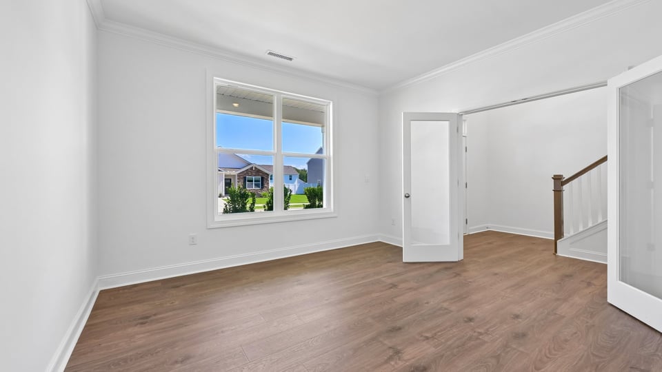 study with glass french doors and revwood flooring