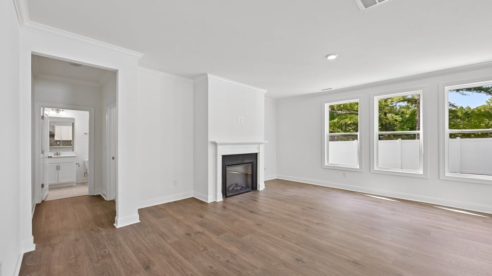 living room with fireplace and lots of natural lighting