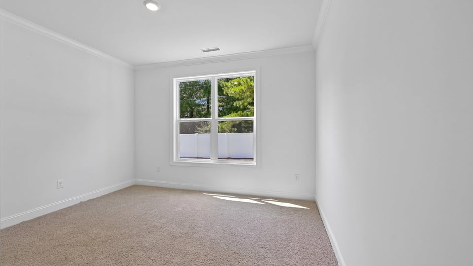 guest bedroom with carpet flooring