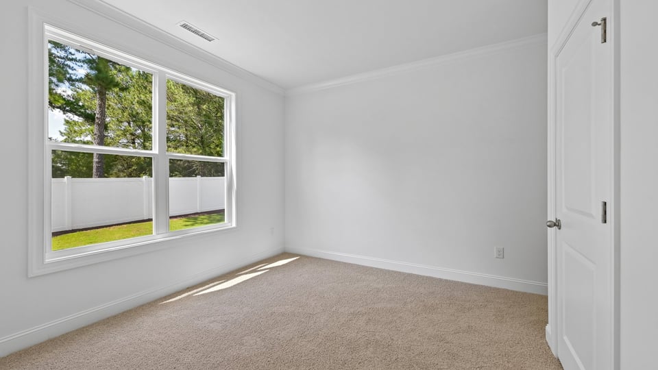 guest bedroom with carpet flooring
