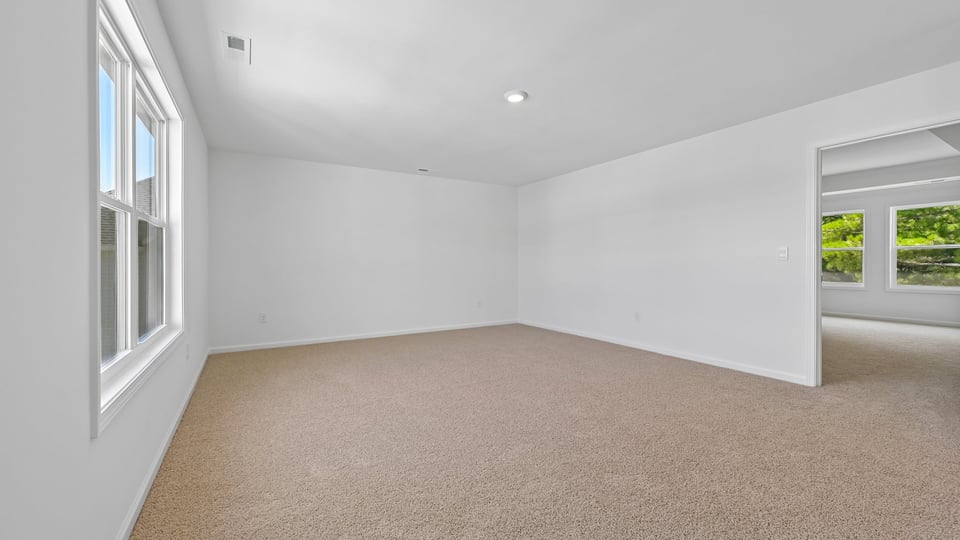 guest bedroom with carpet flooring