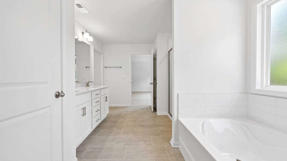 bathroom with separate tub shower