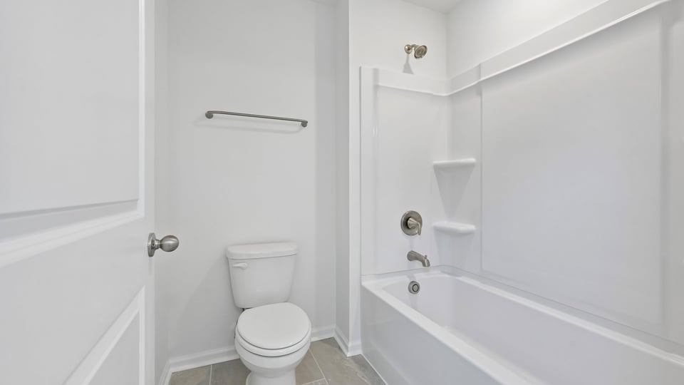 bathroom with tub shower combo