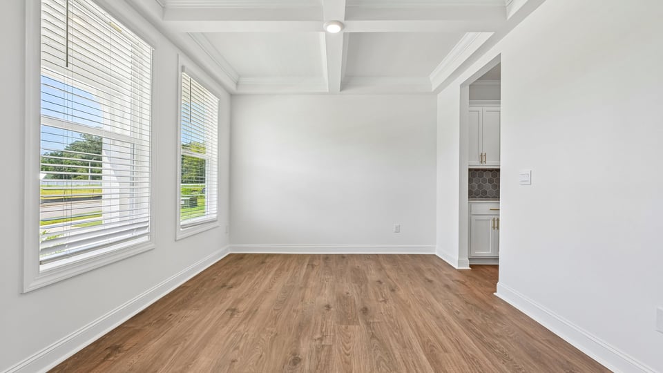 dining room with coffered ceiling