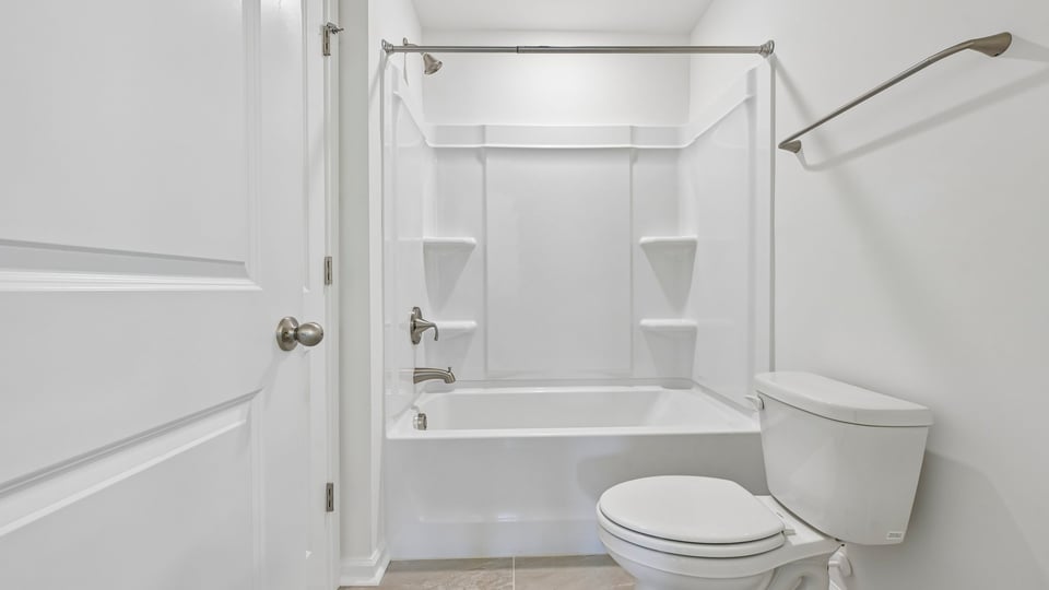 bathroom with tub shower combo