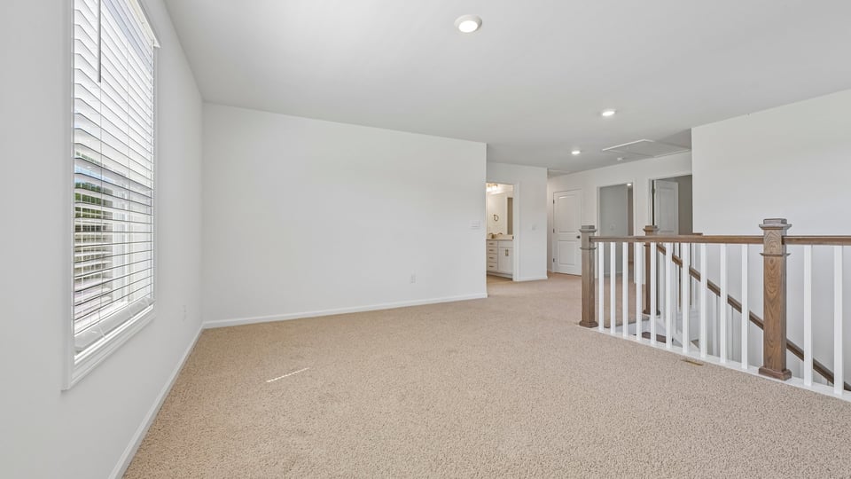 loft with carpet flooring