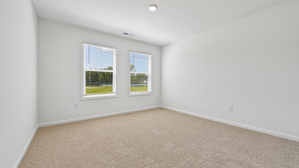 loft with carpet flooring