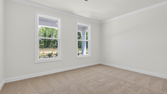 first floor bedroom with carpet flooring