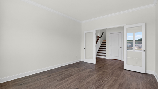 study with french glass doors and revwood flooring