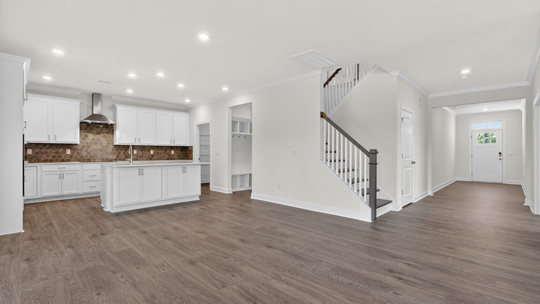 open concept living area with kitchen overlooking living room
