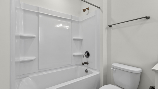 bathroom with tub shower combo