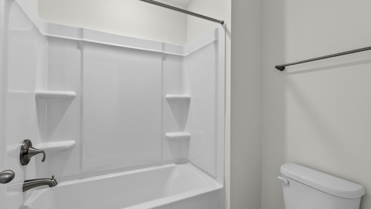 bathroom with tub shower combo