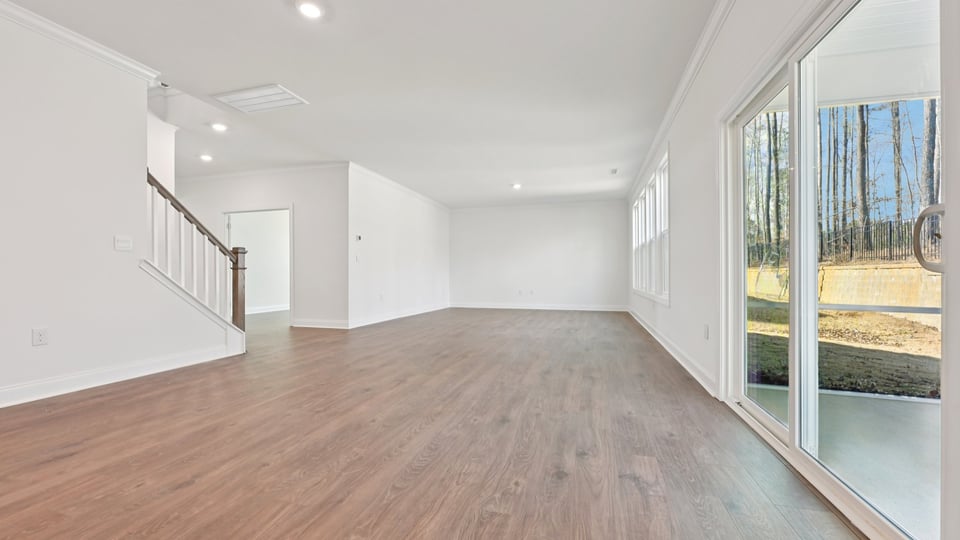 open-concept living room with revwood flooring