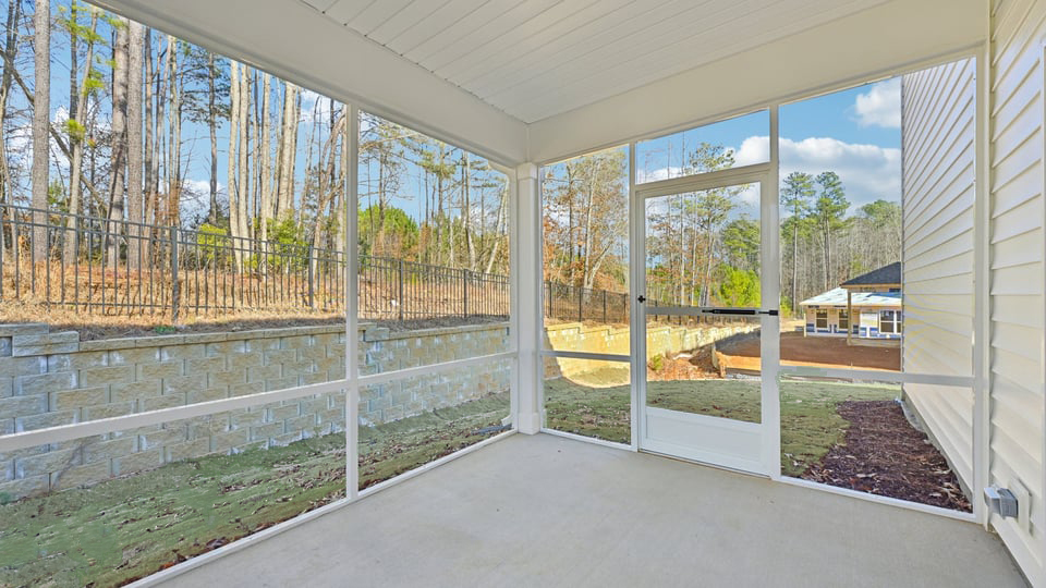 covered and screened in back patio