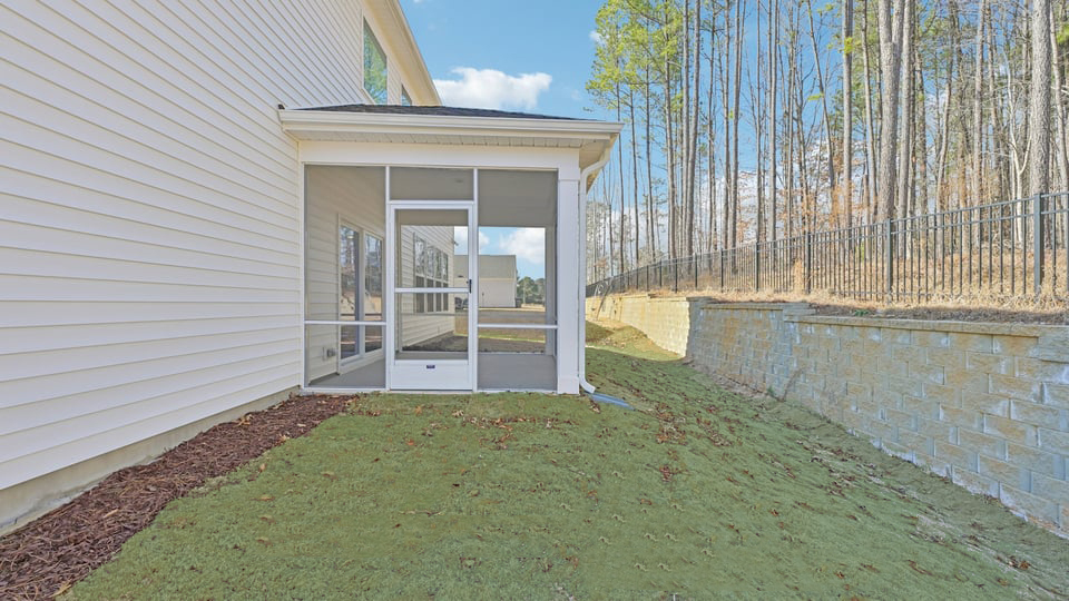 backyard with covered and screened back patio