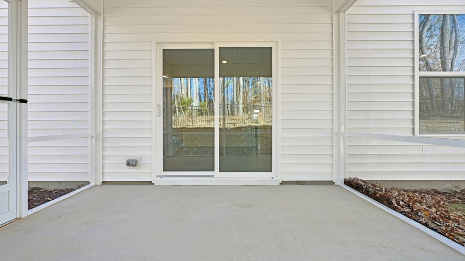 concrete patio with sliding glass doors