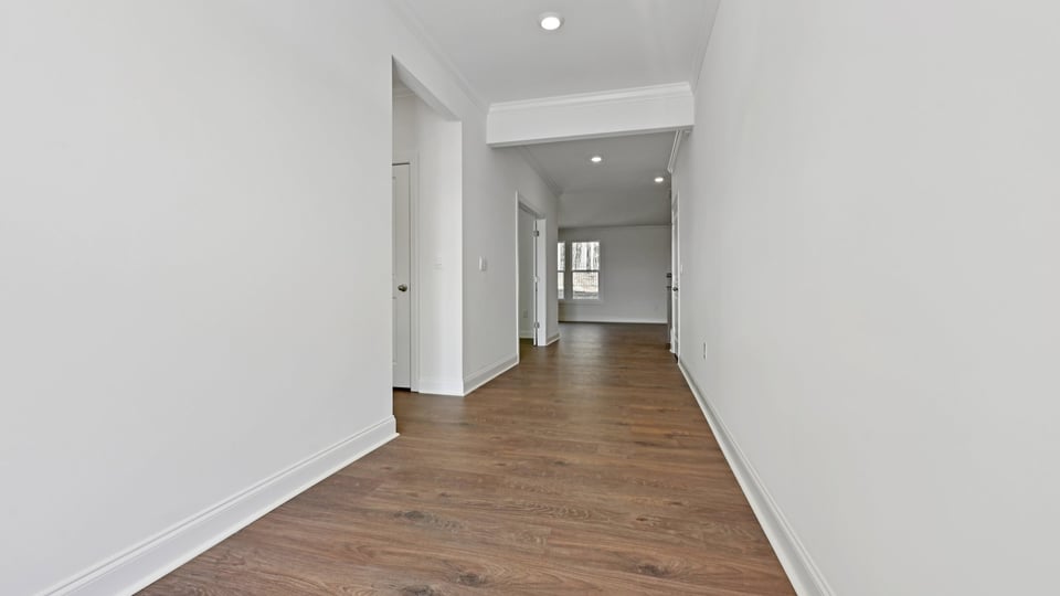 foyer entryway with revwood flooring