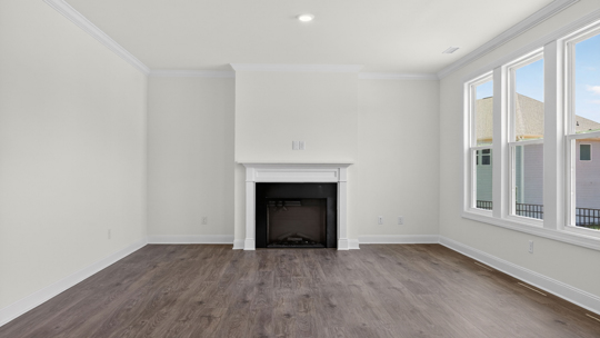 open concept living space with large windows, fireplace